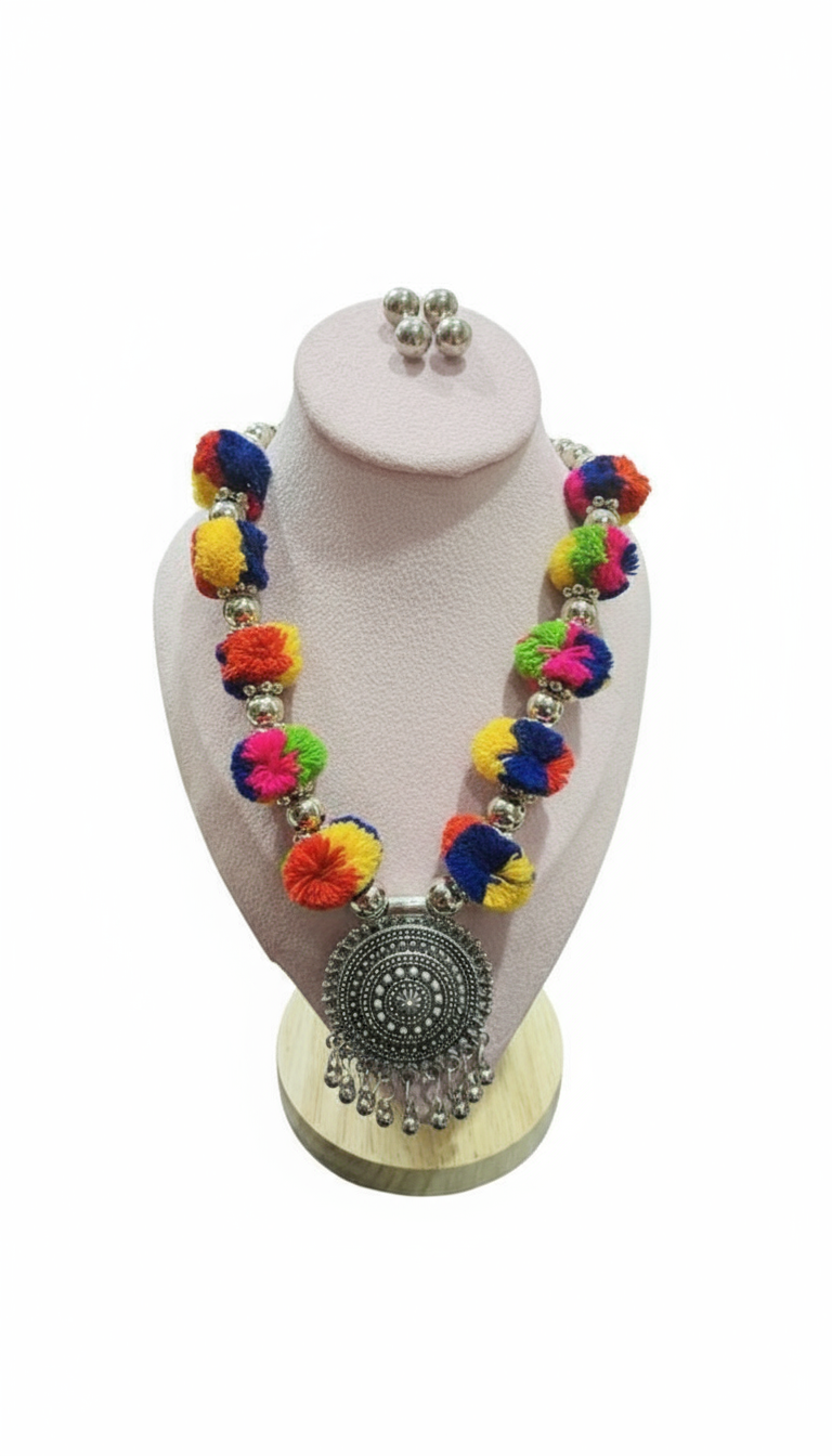 Artistic Flatlay of Pompom Necklace